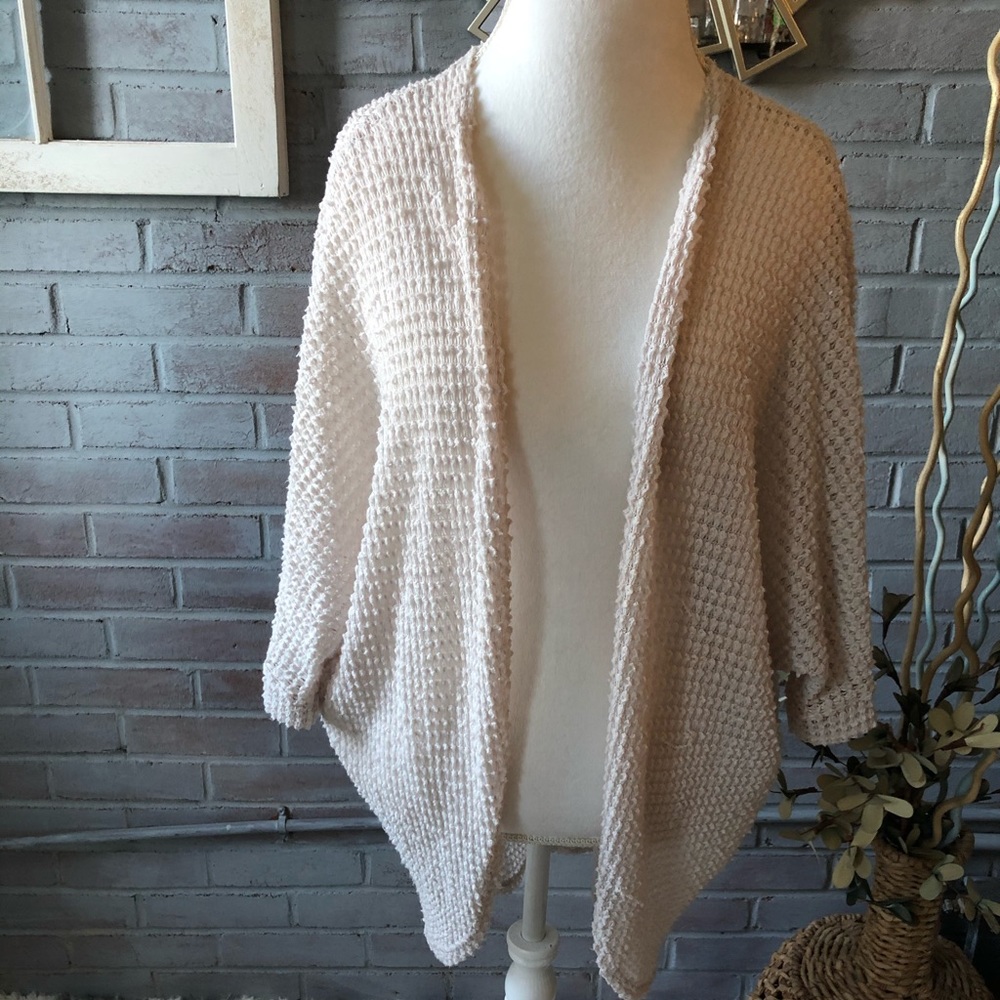 Rolla Coaster woman’s tan cardigan, size medium.